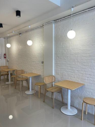 Shared lounge/TV area, nama nimman hostel chiangmai near Benjarong Khantoke