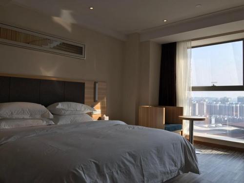 Hotel Pomelo Premier 西柚臻选武昌站酒店 in Suining