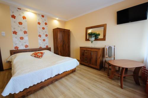 . Pokoje i apartamenty IWONA
