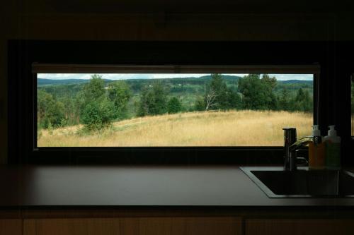 Tiny house between field and forest at Storberget in Elverum