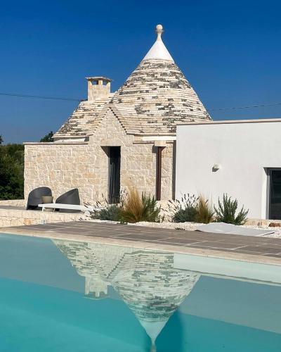 Trullo with infinity pool amid olive groves