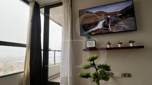 Общ салон/телевизионна зона, Departamento para pareja con vista al mar in Антофагаста