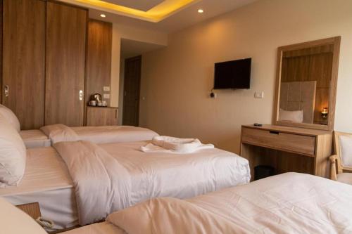 Chambre triple, vue sur le jardin, 3 lits
