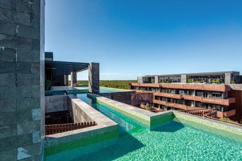 Luxury Condo Steps from Tulum Beach Rooftop Ocean Views Private Jacuzzi Cenotes & Ruins