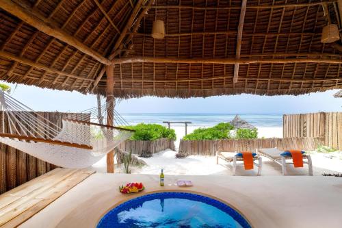 Zanzibar Sunrise at Bandas Room Type - Bungalow - Beach Front Private Pool 