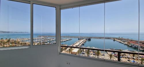 Las Palmeras - Seafront Apartment for 6 with Glazed Terrace and Marina Views