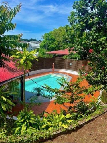 puutarha, La Canopée Enchantée, chambres d'hôtes, piscine, proche aéroport, Gare maritime (La Canopee Enchantee, chambres d'hotes, piscine, proche aeroport, Gare maritime) in Les Abymes