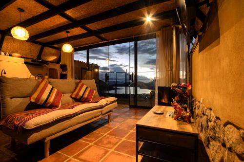 Cabin overlooking the Huaypo Lagoon in the Sacred Valley, Cusco
