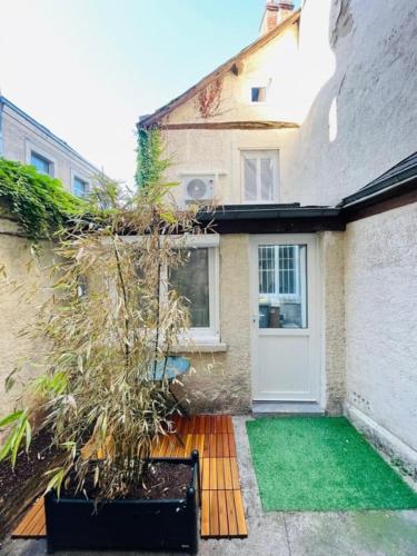 Charmante maison triplex avec jardin
