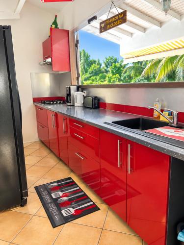 Palvelut, Appartement La Marguerite - Vue mer avec terrasse privée - calme tropical à Deshaies (Appartement La Marguerite - Vue mer avec terrasse privee - calme tropical a Deshaies) in Deshaies