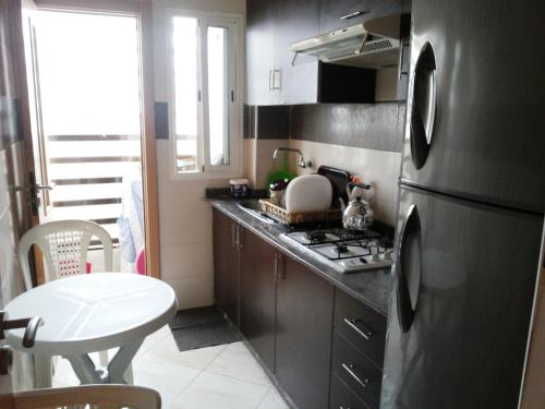 Kitchen, Appart Familiale a Agadir in Al Mohammadi