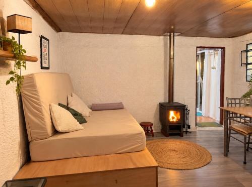 A bright little house in a central location with a wood-burning stove