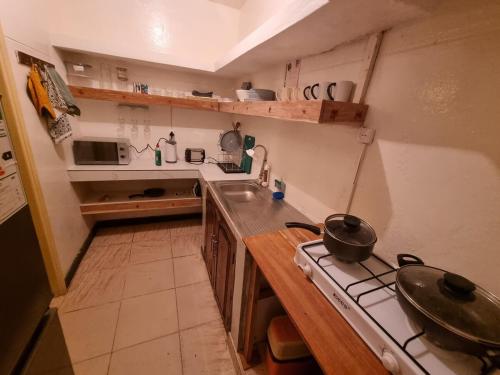 Kitchen, Maison Orera -Town Apartment with Local Food Menu in Nampula