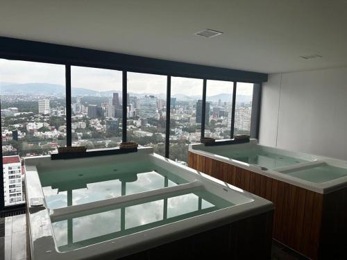 Moderno Loft con Coworking Ejecutivo, Jacuzzi & Gym