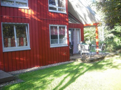 Wooden holiday home in Scandinavian style with a sauna - main image