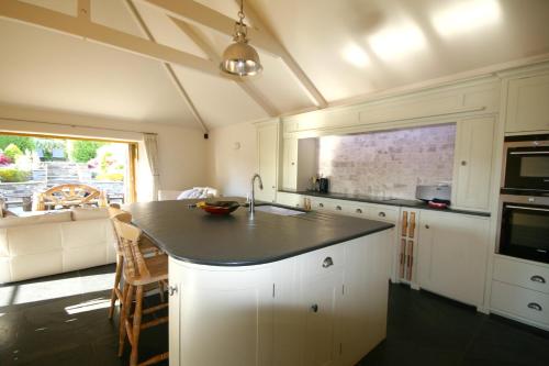 Putsborough Manor 3 Self Catering Cottages with Beach a short walk dog friendly all year, On site Tennis, Play Area, Paddock, Spa baths, BBQ, Private Gardens, Superfast WIFI