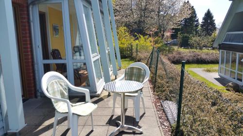 Garden, Ferienwohnung Granitzblick 3 mit Wintergarten und Seeblick in Altensien