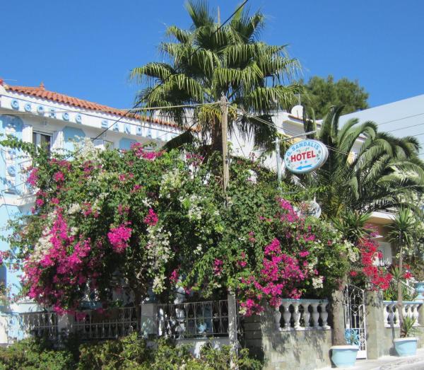 The photo shows the Sandalis Hotel located in the city of Pythagoreio.