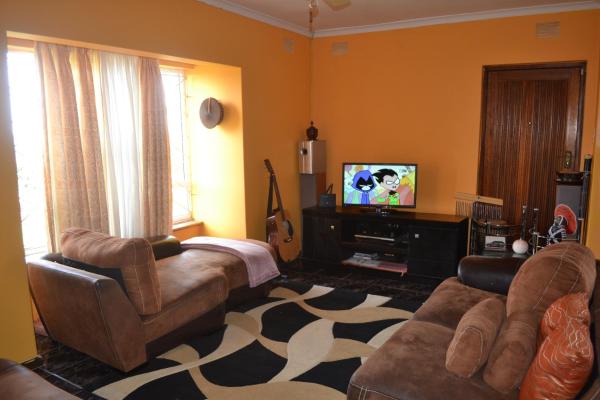 The photo shows the Mkhumbane Backpackers located in the city of Queensburgh.