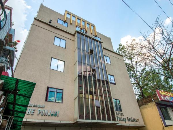 The photo shows the Hotel Pratap Residency located in the city of Nāmkom.