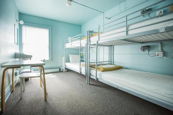 The photo shows the American Hotel Hostel located in the city of Seattle.