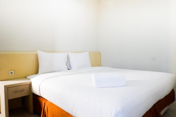 En la foto se muestra el objeto Comfy 1BR Twin Tower Apartment By Travelio ubicado en la ciudad de Gembong.