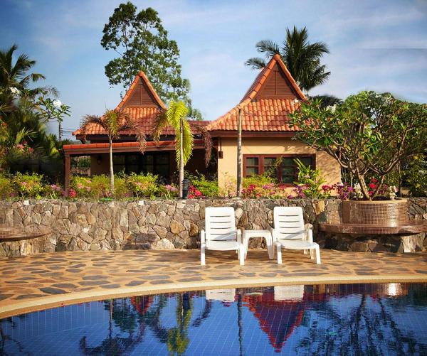 A la foto es mostra l'objecte Family-friendly house, a few steps from the pool and close to the ocean. situat a la ciutat de Ban Bua Phut.