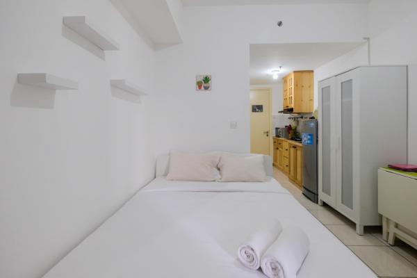 A la foto es mostra l'objecte Studio Apartment at M-Town Residence near Summarecon Mall Serpong By Travelio situat a la ciutat de Pumpangsineng.