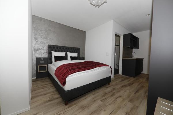 The photo shows the Business Apartments Reichenburg located in the city of Bilten.