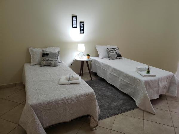 A la foto es mostra l'objecte Apartamento Temporada Santa Rita situat a la ciutat de Muriaé.