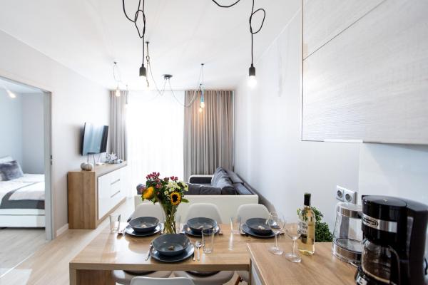 The photo shows the Apartament Silver Leśne Tarasy located in the city of Radawka.