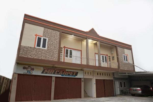 Na fotografii je vidět objekt RedDoorz Syariah near Sultan Syarif Kasim II Airport nacházející se ve městě Kelapas.