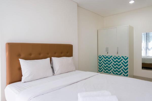 A la foto es mostra l'objecte Modern and Cozy 1BR Brooklyn Alam Sutera Apartment By Travelio situat a la ciutat de Dongkal.