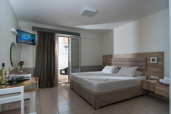 The photo shows the Vagelis Apartments Malia located in the city of Malia.