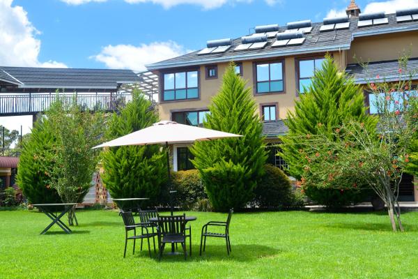 The photo shows the Misty Mountain Lodge located in the city of Naro Moru.