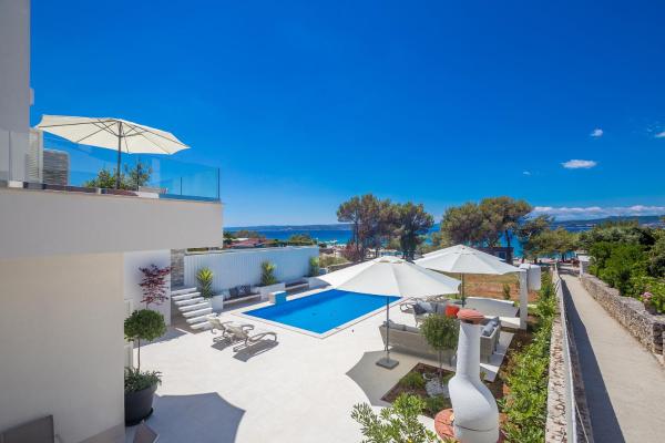 Na fotografii je vidět objekt Luxury villa Punat with pool with sea view , 50m from the beach by WiiBuk nacházející se ve městě Krk.