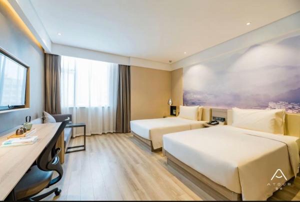 The photo shows the Atour Hotel (Jiangyin Binjiang Middle Road Sports Center) located in the city of Wuxi.