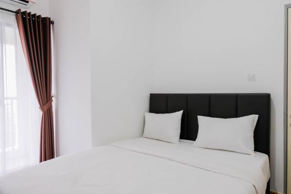 A la foto es mostra l'objecte Elegant and Convenient 2BR M-Town Residence Apartment By Travelio situat a la ciutat de Pumpangsineng.