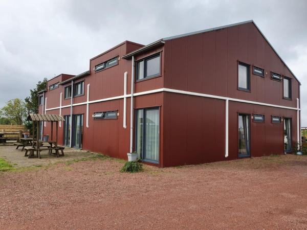 Na zdjęciu widoczny jest obiekt Hotel Dijkzicht położony w mieście Spijk.