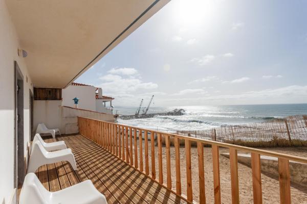 A la foto es mostra l'objecte Blue Buddha Beach Rooms & Suites situat a la ciutat de Ericeira.