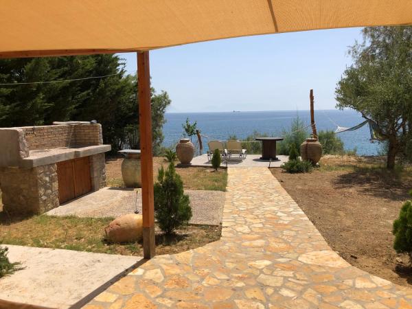 The photo shows the Seafront Studio with direct beach access located in the city of Livadhákia.