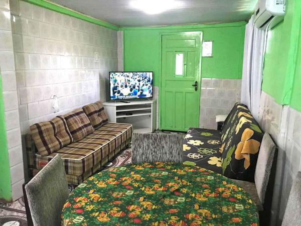 The photo shows the Residenciais Casa Verde Gramado located in the city of Gramado.