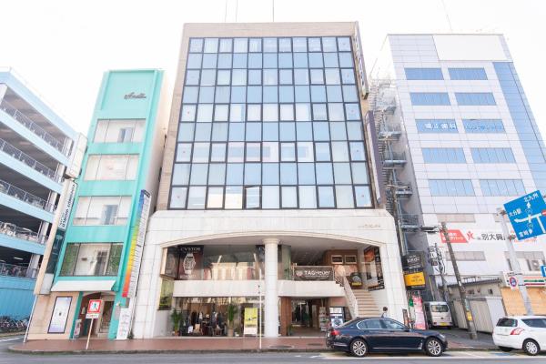 The photo shows the Tabist Hotel Smart Sleeps Oita Station located in the city of Oita.