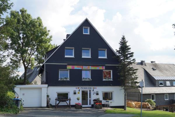 The photo shows the Hotel Pension De Gasterei located in the city of Winterberg.