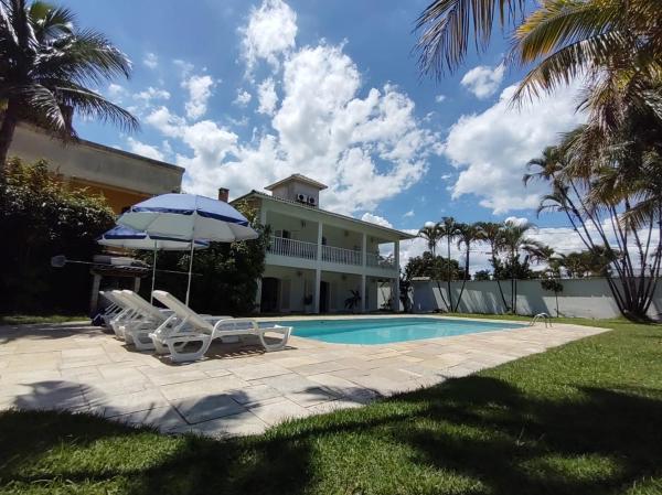 A la foto es mostra l'objecte Casa Eventos e Temporada com 4 suites, piscina, churrasqueira, Wi-Fi, Ar Condicionado - Proximo Praia Mar Casado e Pernambuco - Guaruja - situat a la ciutat de Guarujá.