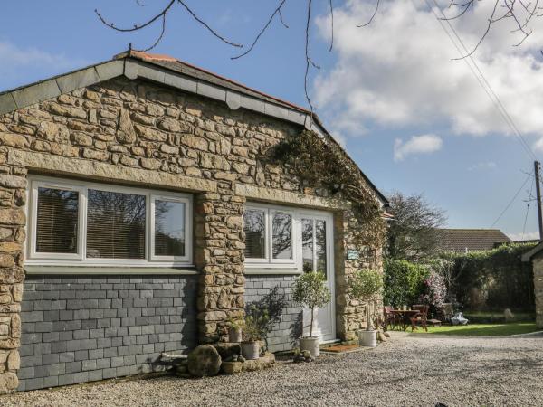 A la foto es mostra l'objecte Honeysuckle Cottage situat a la ciutat de Breage.