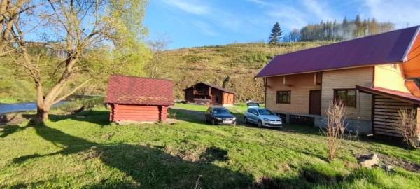 A la foto es mostra l'objecte Котедж біля річки situat a la ciutat de Kelechin.