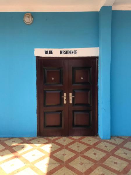 The photo shows the BLUE RESIDENCE located in the city of Bakau.