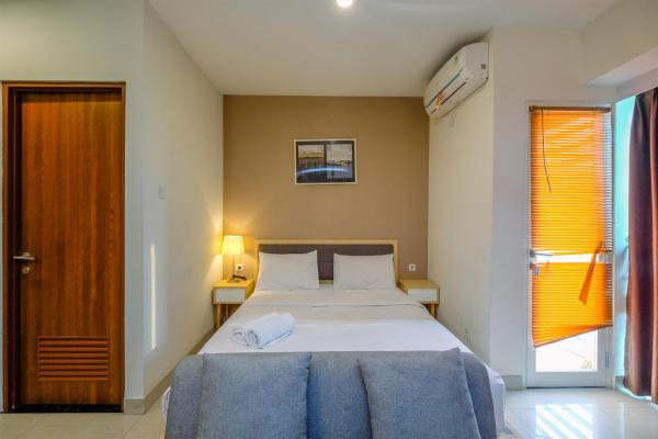På billedet ses objektet Modern and Spacious Studio with City View @ Grand Kamala Lagoon Apartment By Travelio beliggende i byen Pekayon Satu.