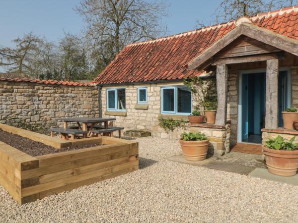 A la foto es mostra l'objecte Foxglove Cottage situat a la ciutat de Harome.